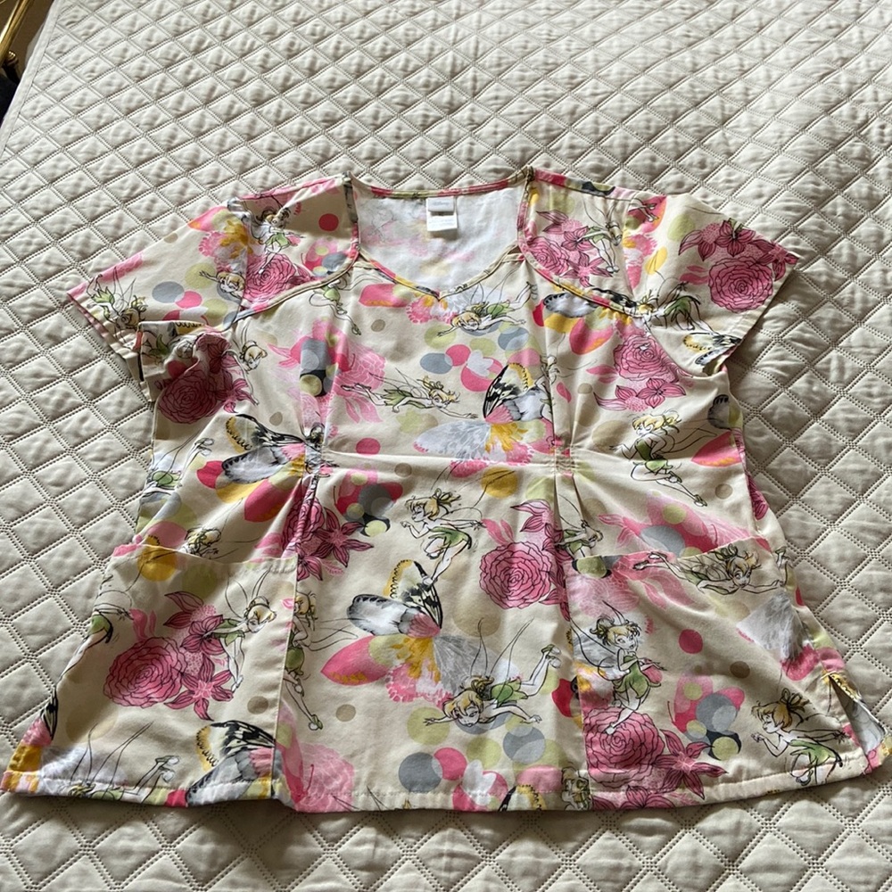 Disney brand scrub top featuring Tinkerbell.